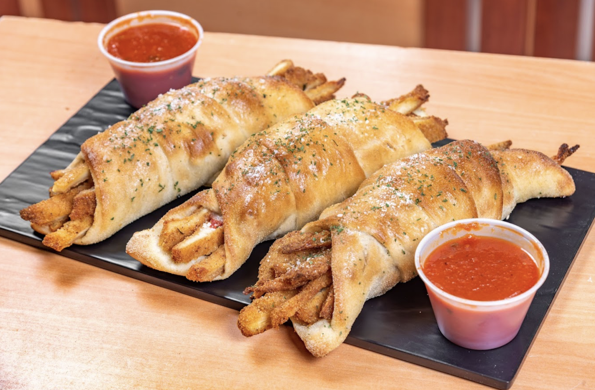 Fresh baked specialty rolls served with marinara sauce